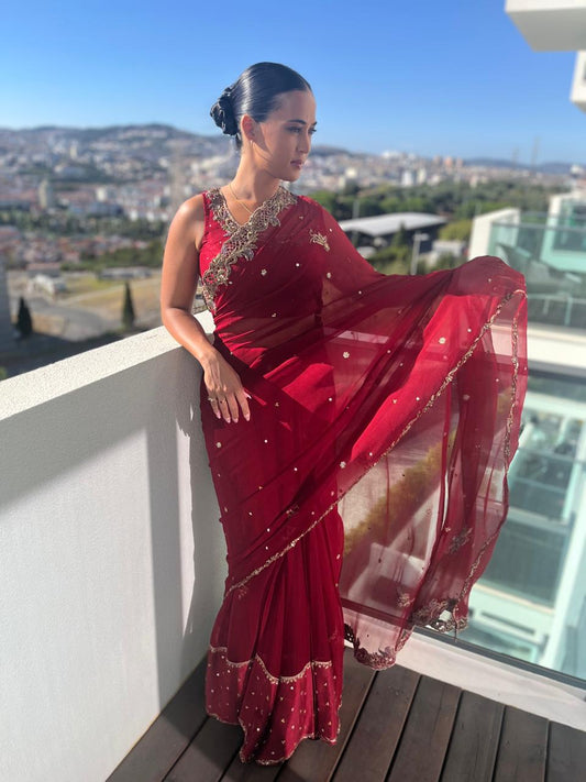 Maroon chiffon saree with gold cutwork border