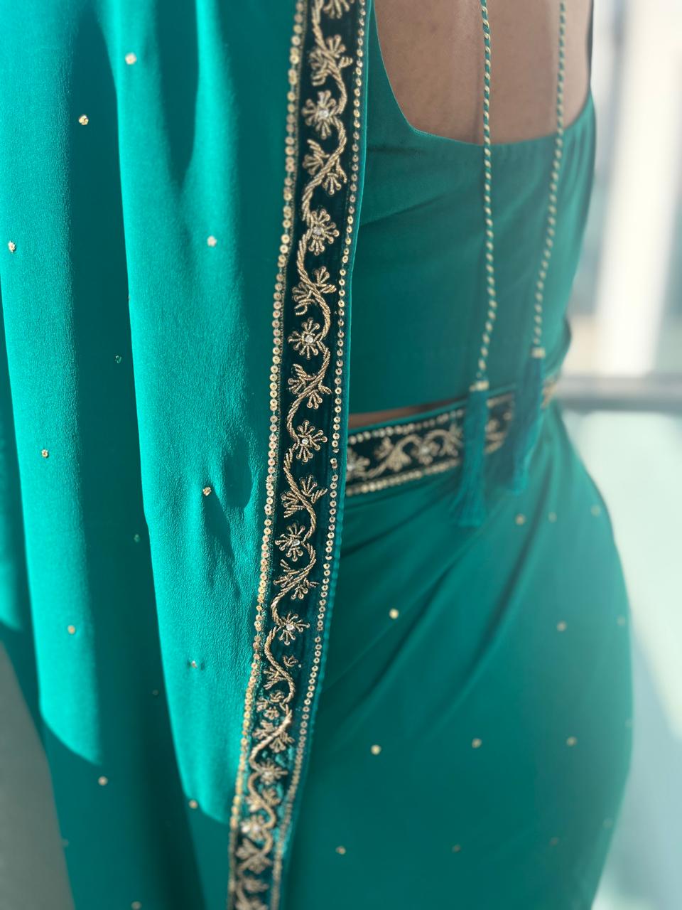 Emerald green silk saree with velvet detail blouse